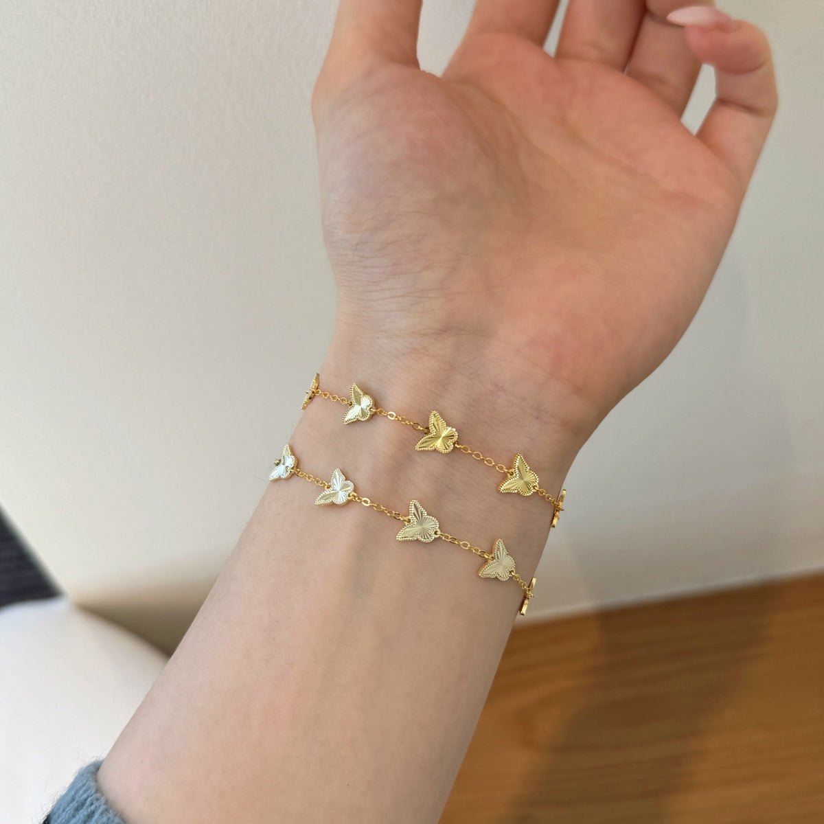 Golden Flutter: 18K Gold-Plated Butterfly Charm Bracelet