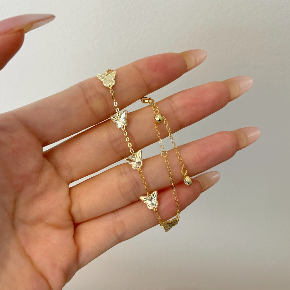 Golden Flutter: 18K Gold-Plated Butterfly Charm Bracelet
