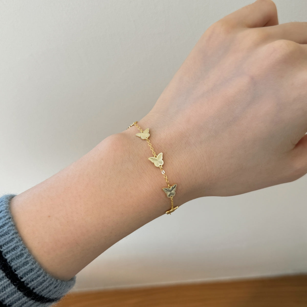 Golden Flutter: 18K Gold-Plated Butterfly Charm Bracelet