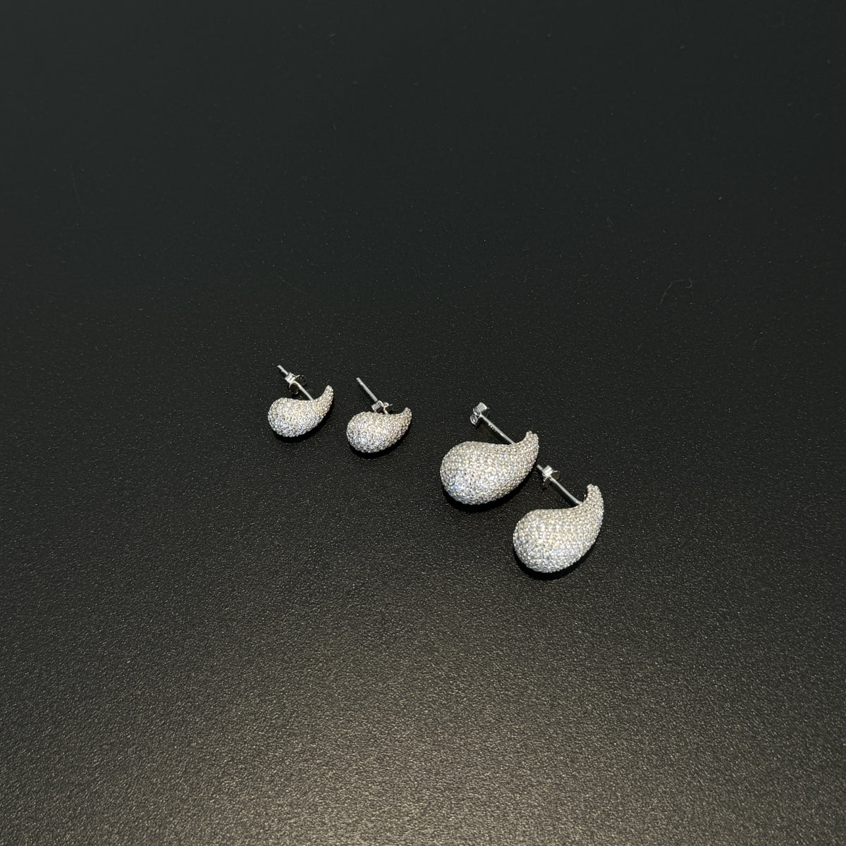 "Elegant Radiance" Teardrop Stud Earrings Sculpted Light. Effortless Glamour.