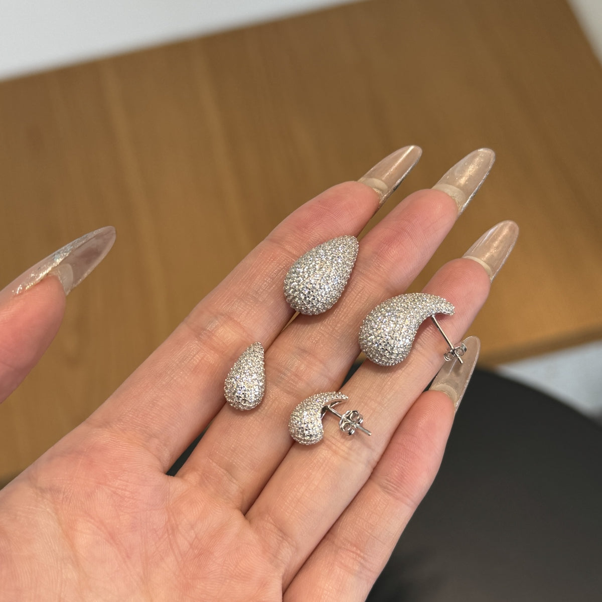 "Elegant Radiance" Teardrop Stud Earrings Sculpted Light. Effortless Glamour.