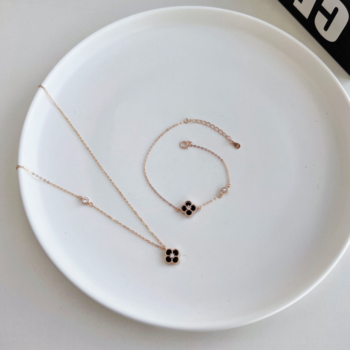 Noir Bloom: Black Enamel Clover Pendant Necklace