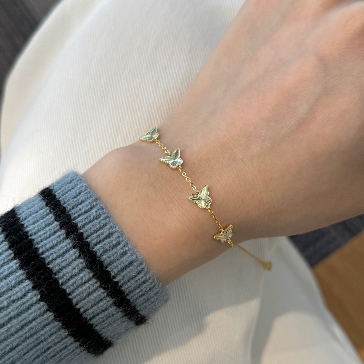Golden Flutter: 18K Gold-Plated Butterfly Charm Bracelet